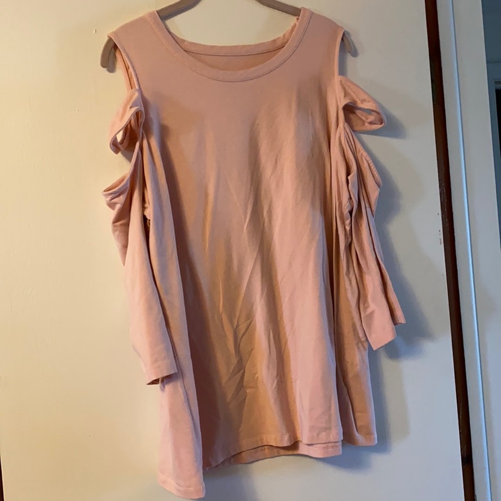 Pink top with sleeve cutouts